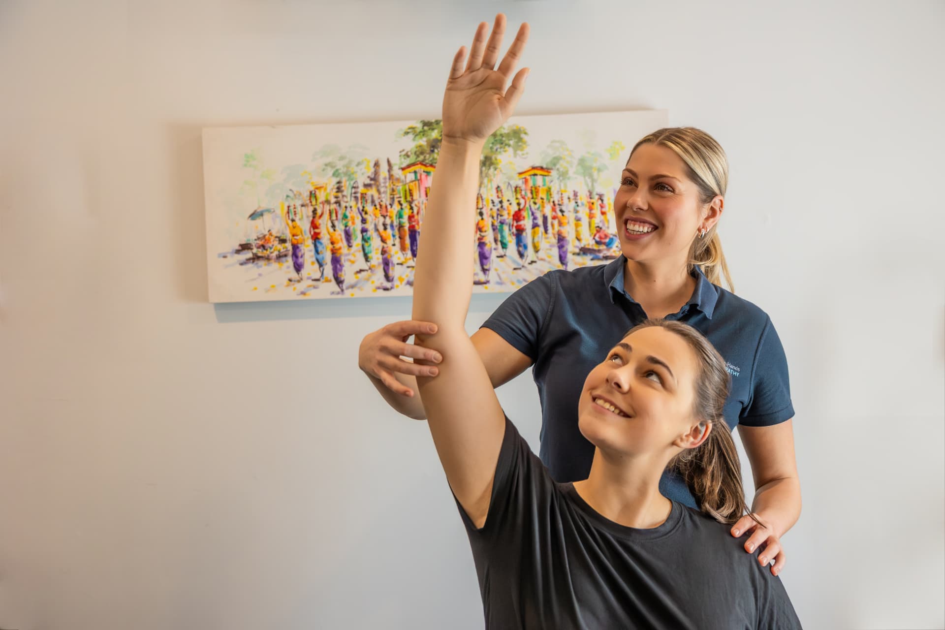 Healing Hands osteopath assisting a patient with an exercise at the Croydon clinic